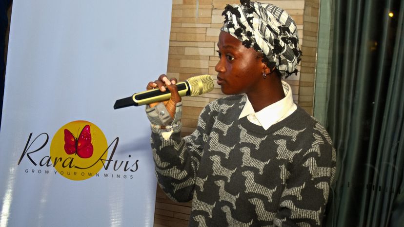 artist holding a microphone