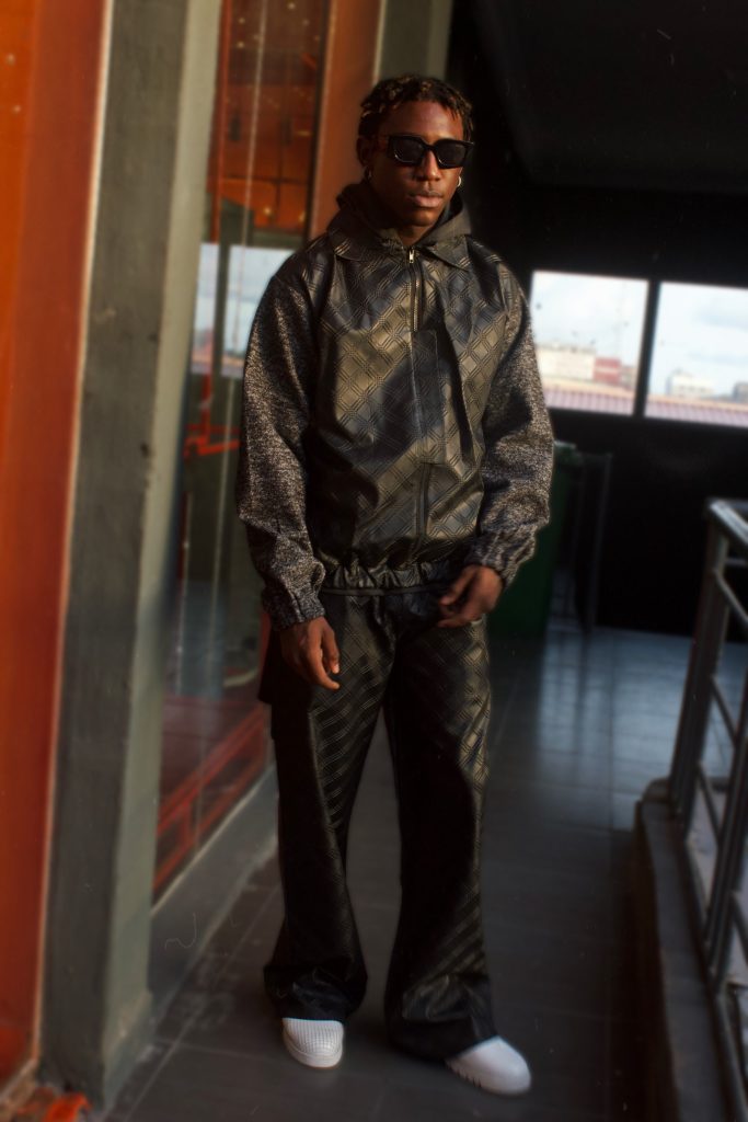 Shallipopi fitted in old & New luxury brand outfit